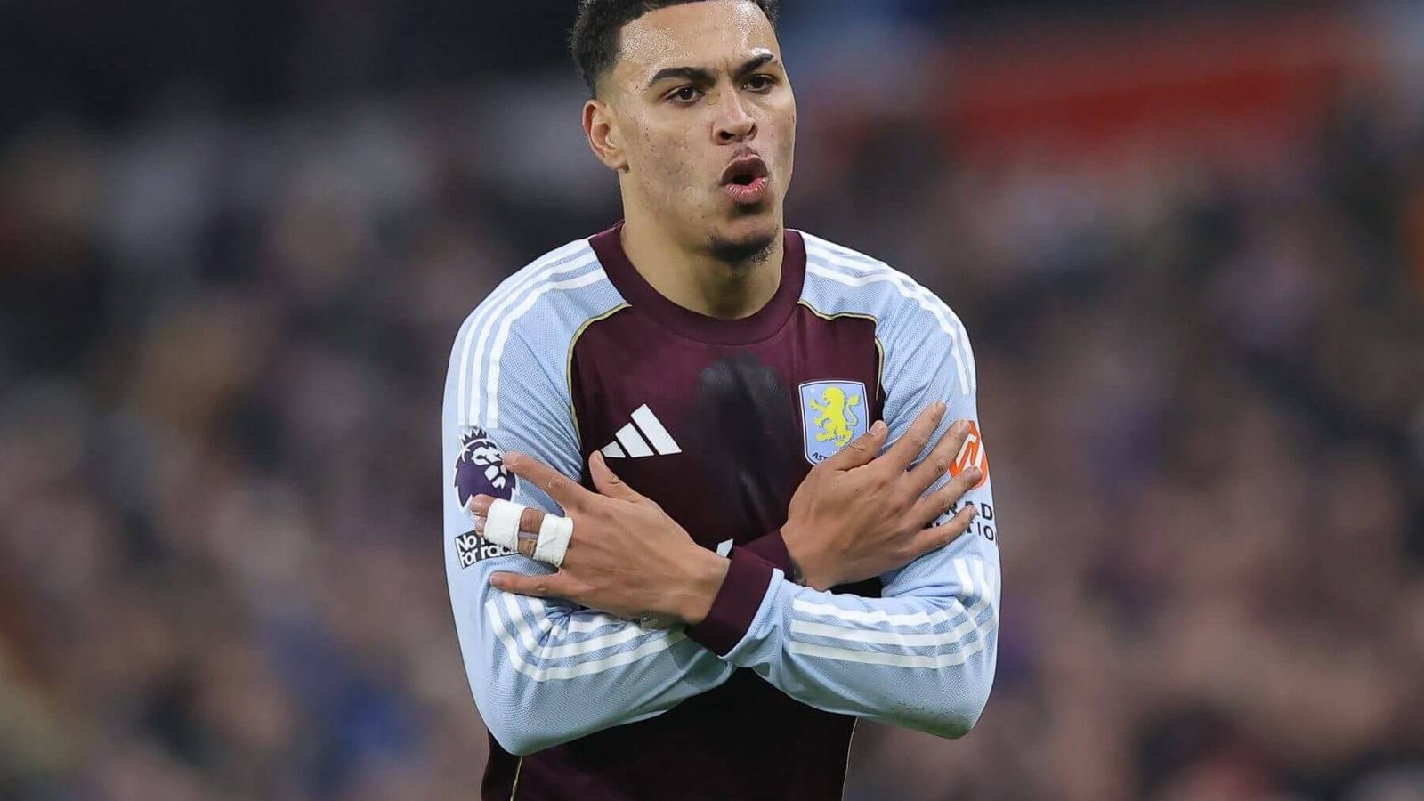 Morgan Rogers celebrating a goal while wearing the Aston Villa football kit