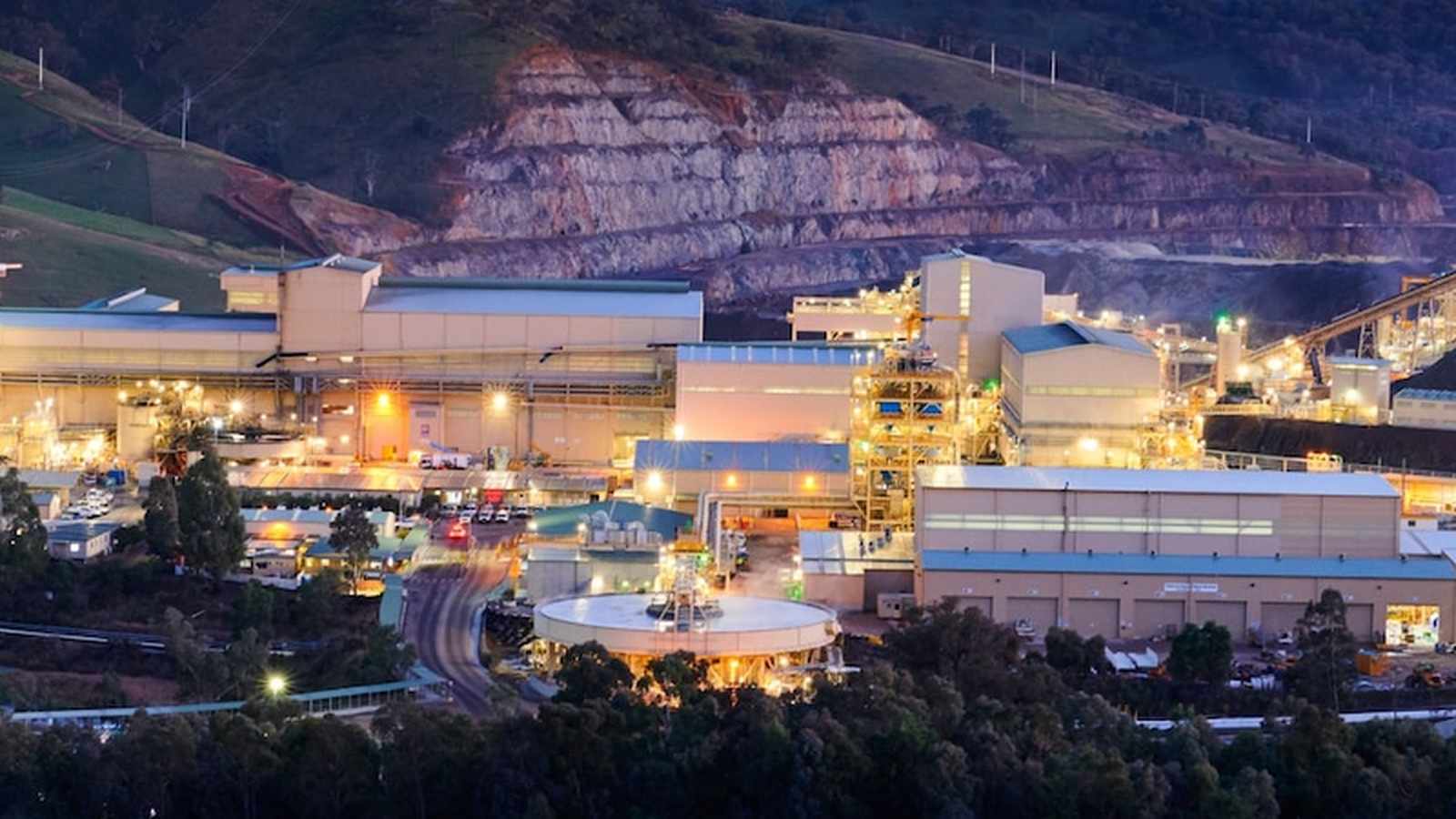 Aerial view of the illuminated Cadia gold mine processing facility at dusk