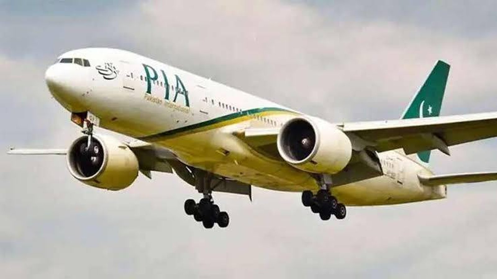 A Pakistan International Airlines passenger jet taking off against a cloudy sky background