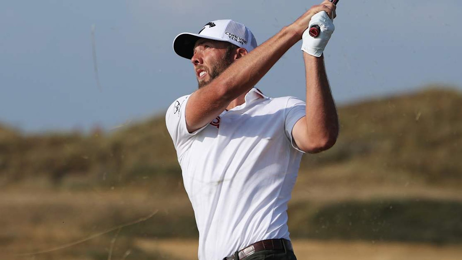Professional golfer Sam Burns follows through on a swing during a tournament round