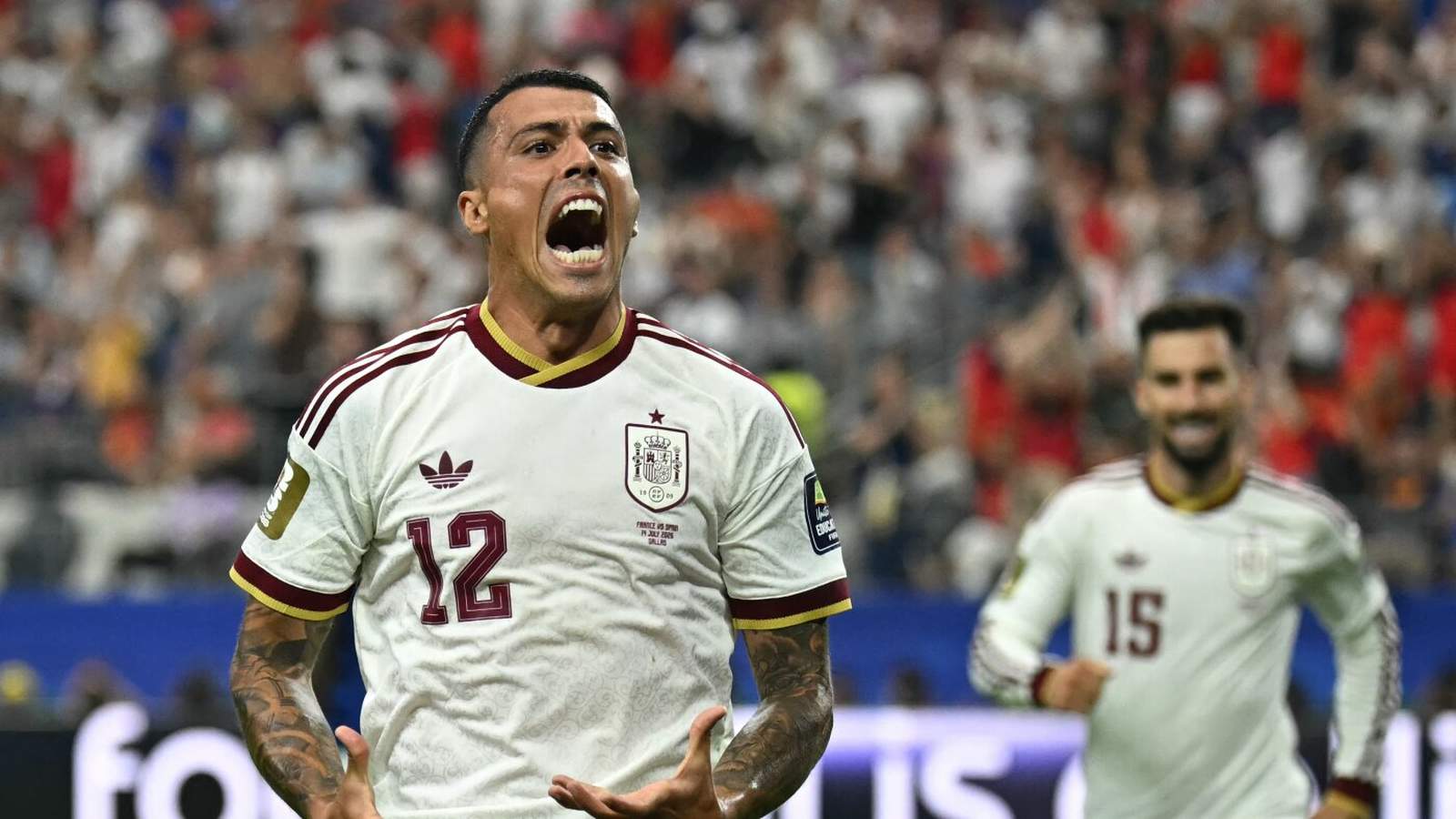Spanish soccer player in white jersey celebrating passionately during 2026 World Cup match