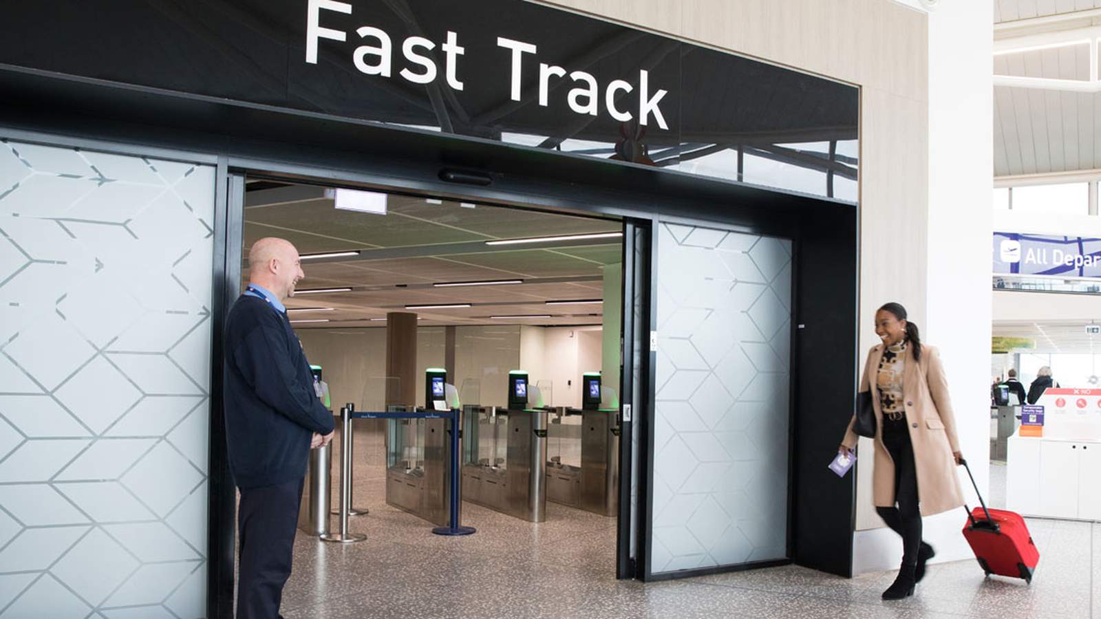 A passenger walking through the new Fast Track security entrance at Sydney Airport terminal