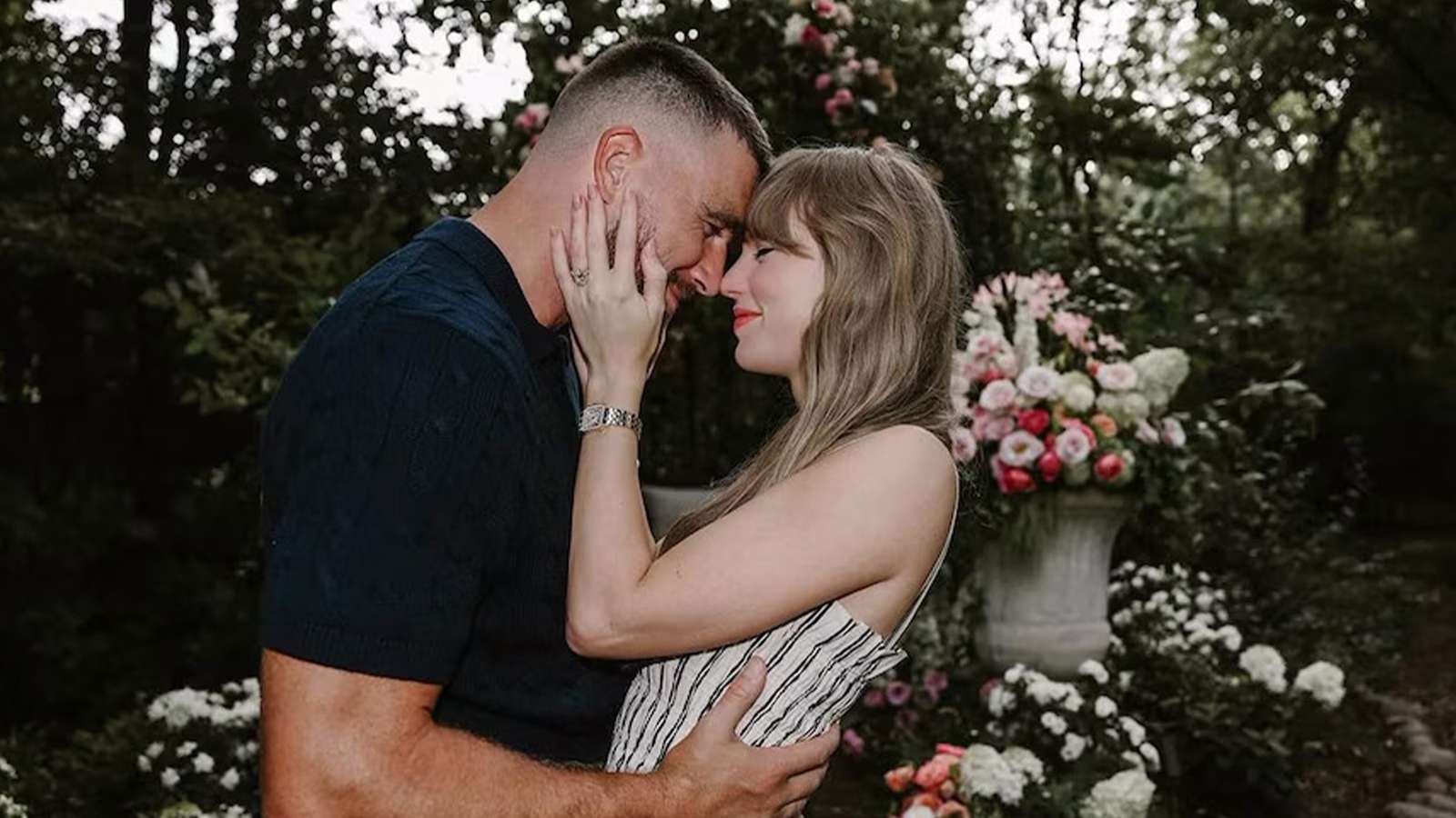Taylor Swift and Travis Kelce sharing an intimate moment in a garden setting