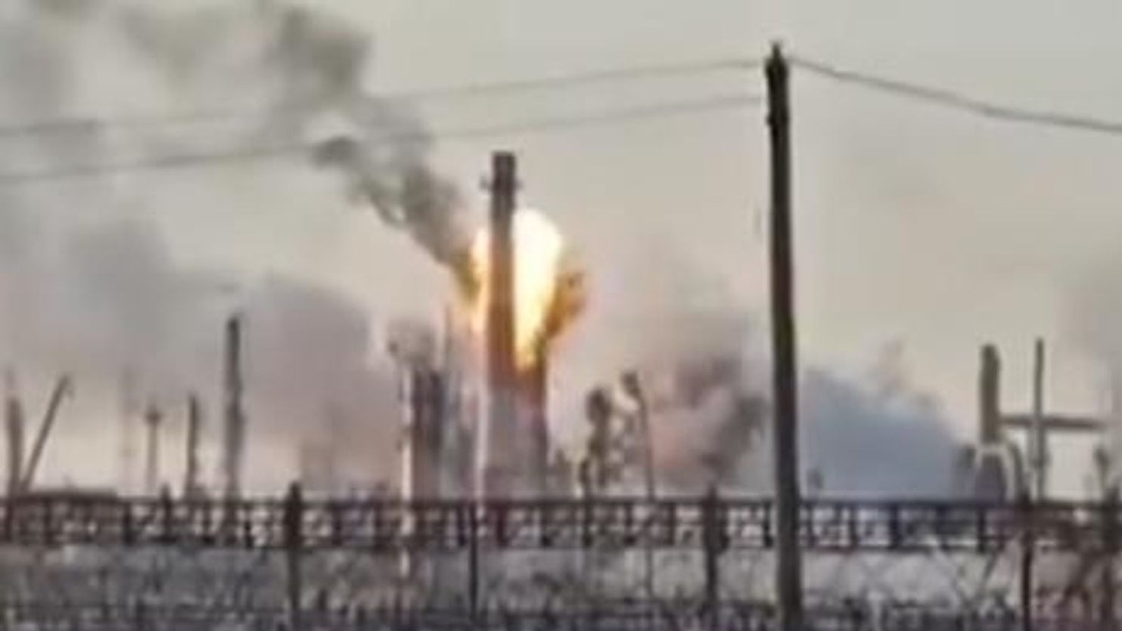 A large explosion and smoke rising from a Russian oil refinery facility