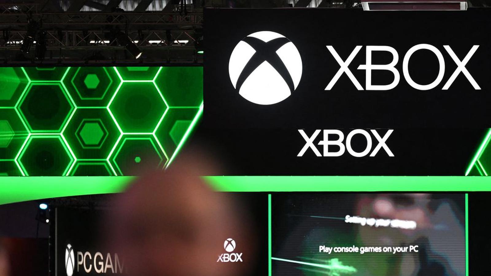 Large illuminated Xbox logo and branding displayed above a crowded gaming convention floor