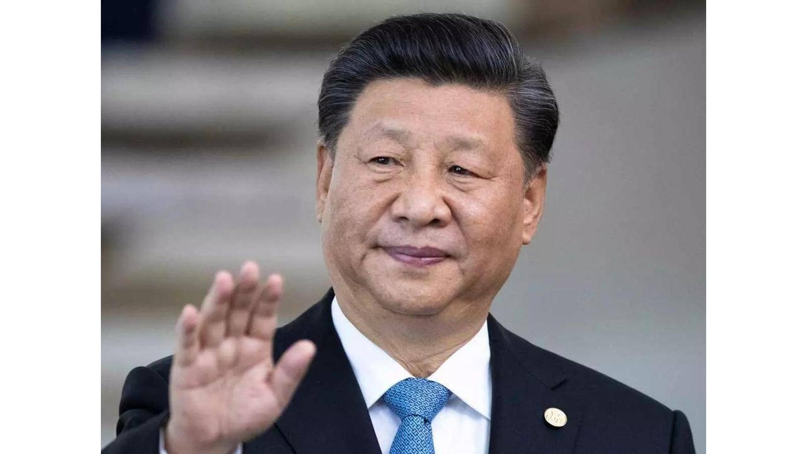 Chinese President Xi Jinping waving during a public appearance at an official event
