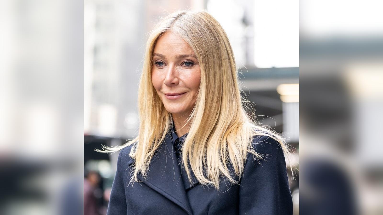 Close up portrait of actress Gwyneth Paltrow with blonde hair wearing a coat
