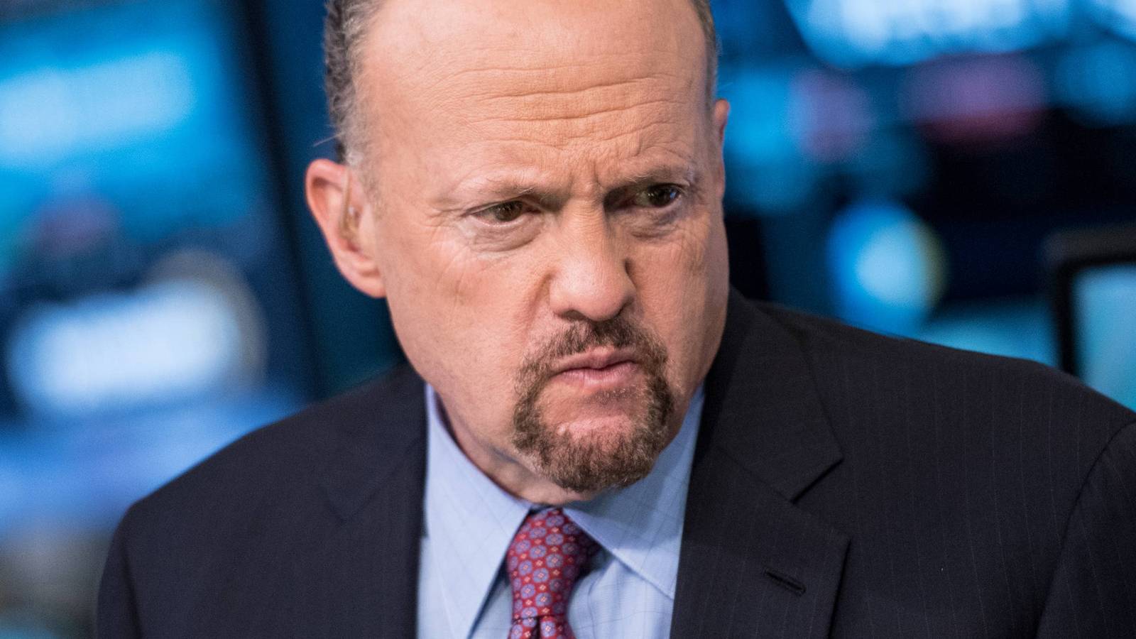 Jim Cramer wearing a suit and tie looking serious in a television studio