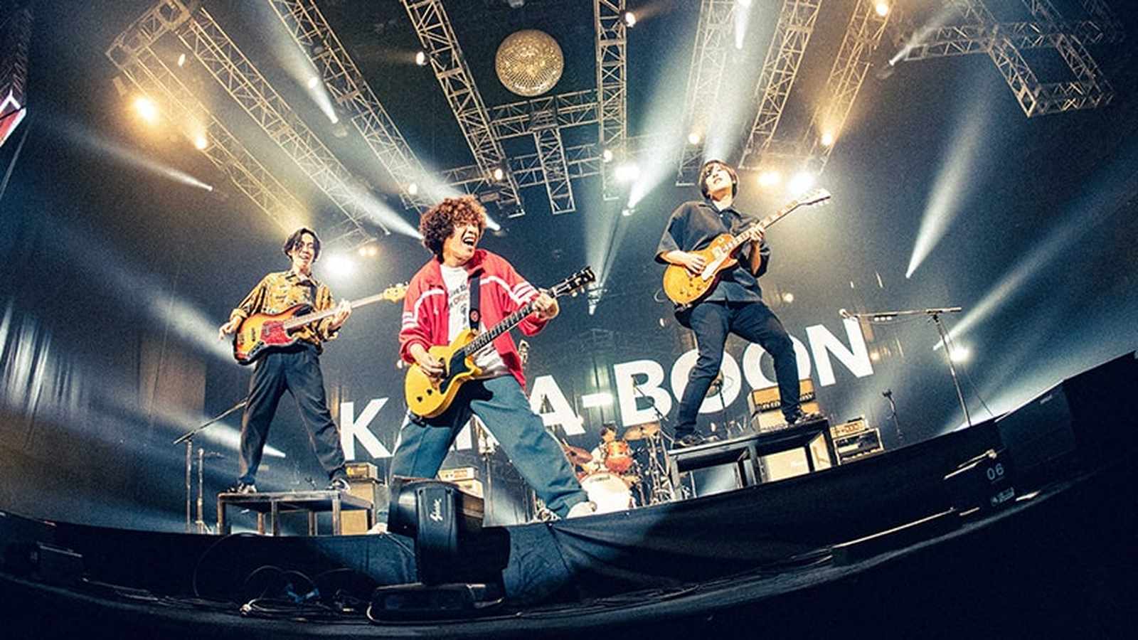 Japanese rock band KANA-BOON performing live on stage with guitars and stage lighting