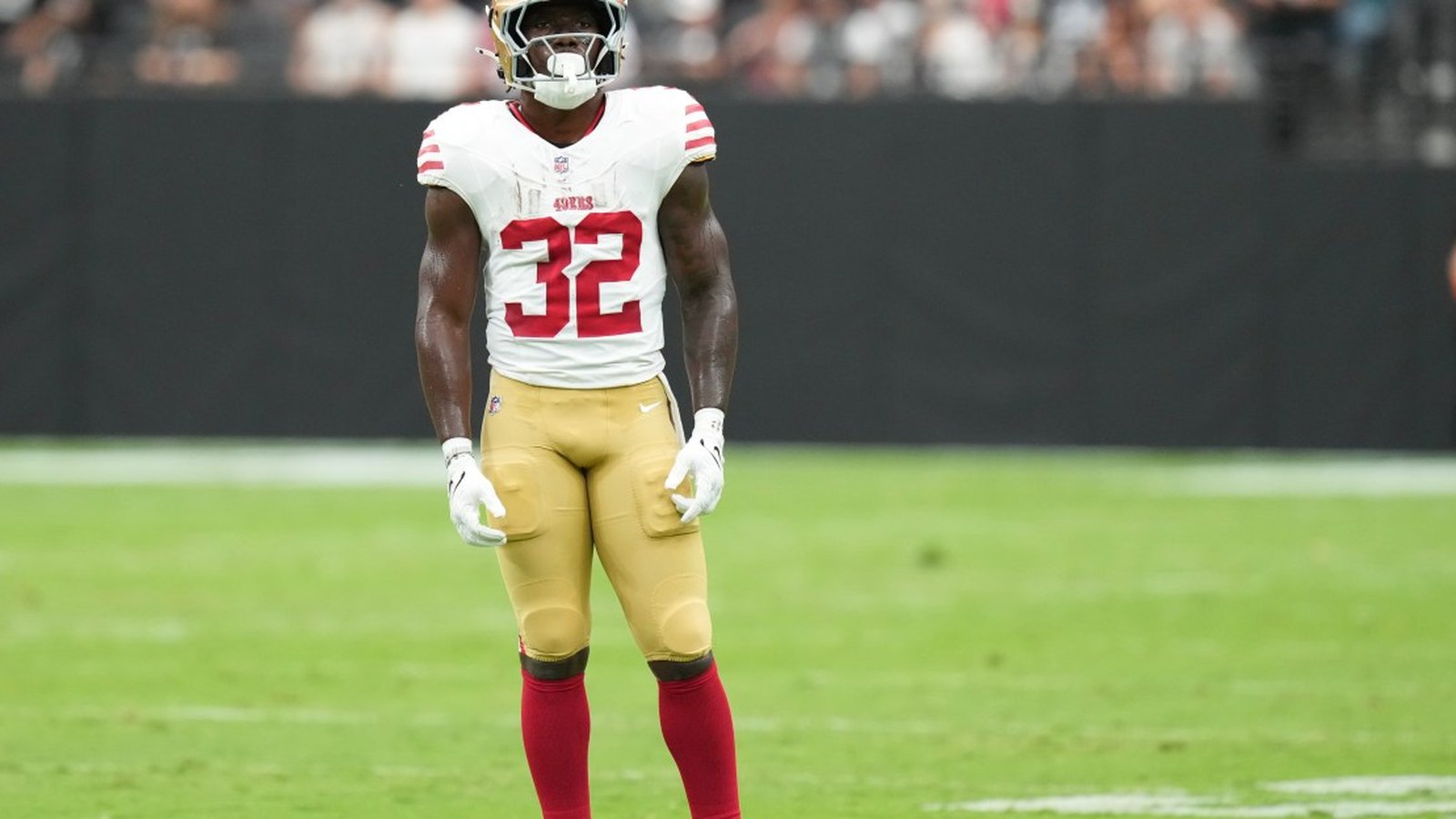 San Francisco 49ers running back Khalil Herbert standing on the field in uniform