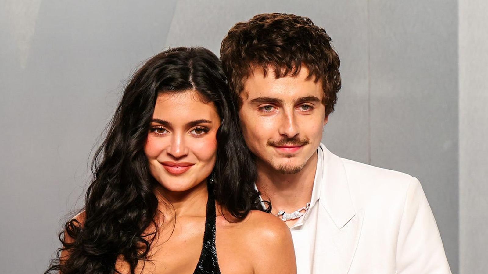Kylie Jenner and Timothée Chalamet posing together for a formal event portrait