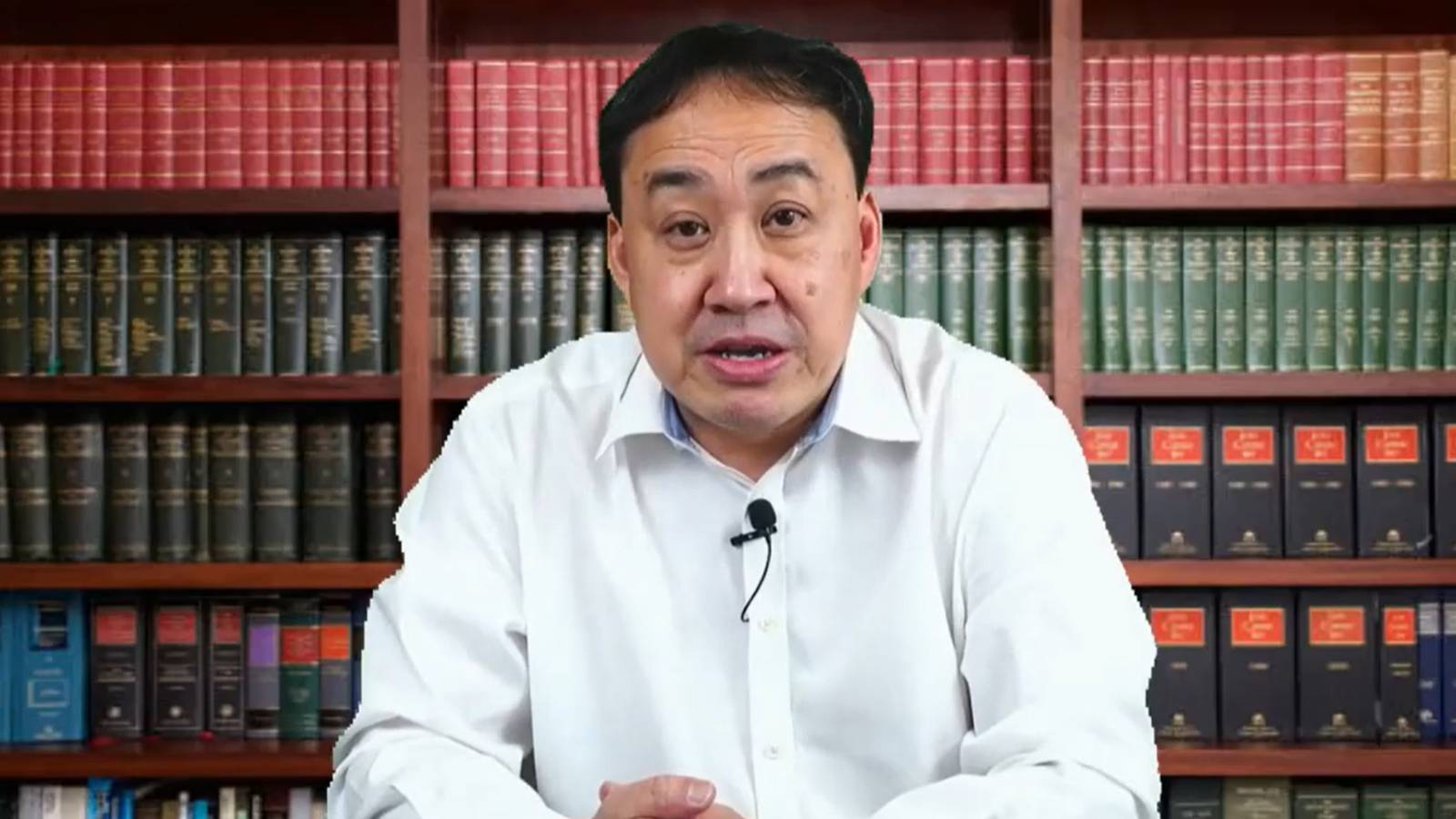 Singaporean lawyer and opposition politician Lim Tean sitting in front of a bookshelf