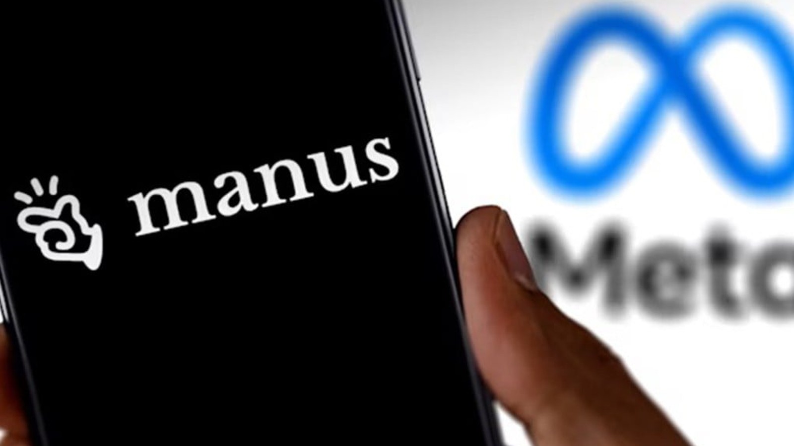 A hand holding a smartphone displaying the Manus logo with the Meta logo blurred in background