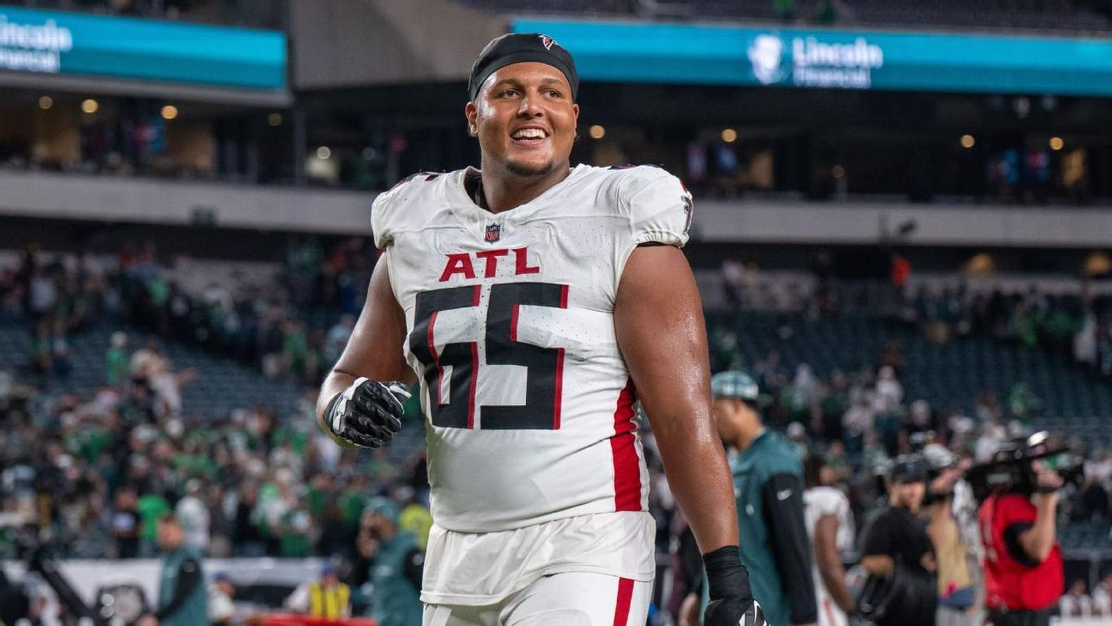 Atlanta Falcons offensive guard Matthew Bergeron smiling on the field during a game