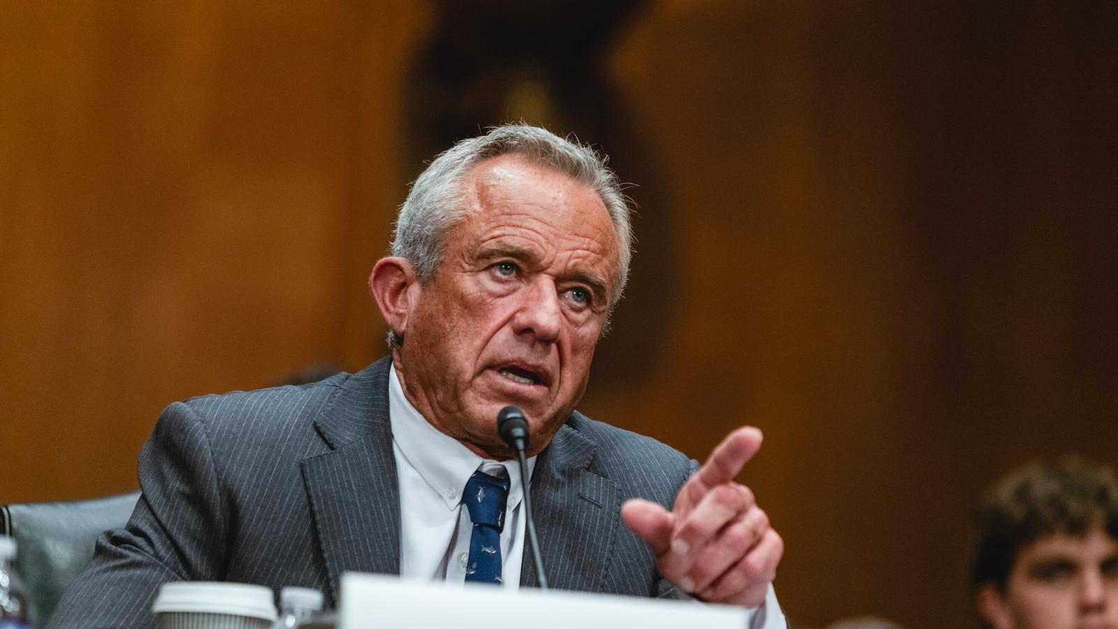 Robert F. Kennedy Jr. wearing a suit and tie speaking during a hearing