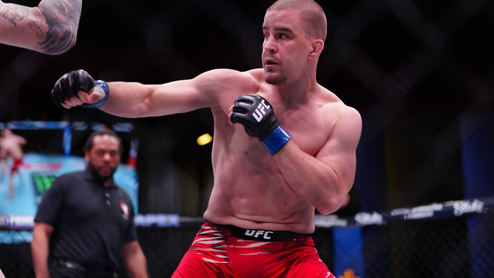 UFC fighter Robert Valentin throwing a punch during a professional mixed martial arts match
