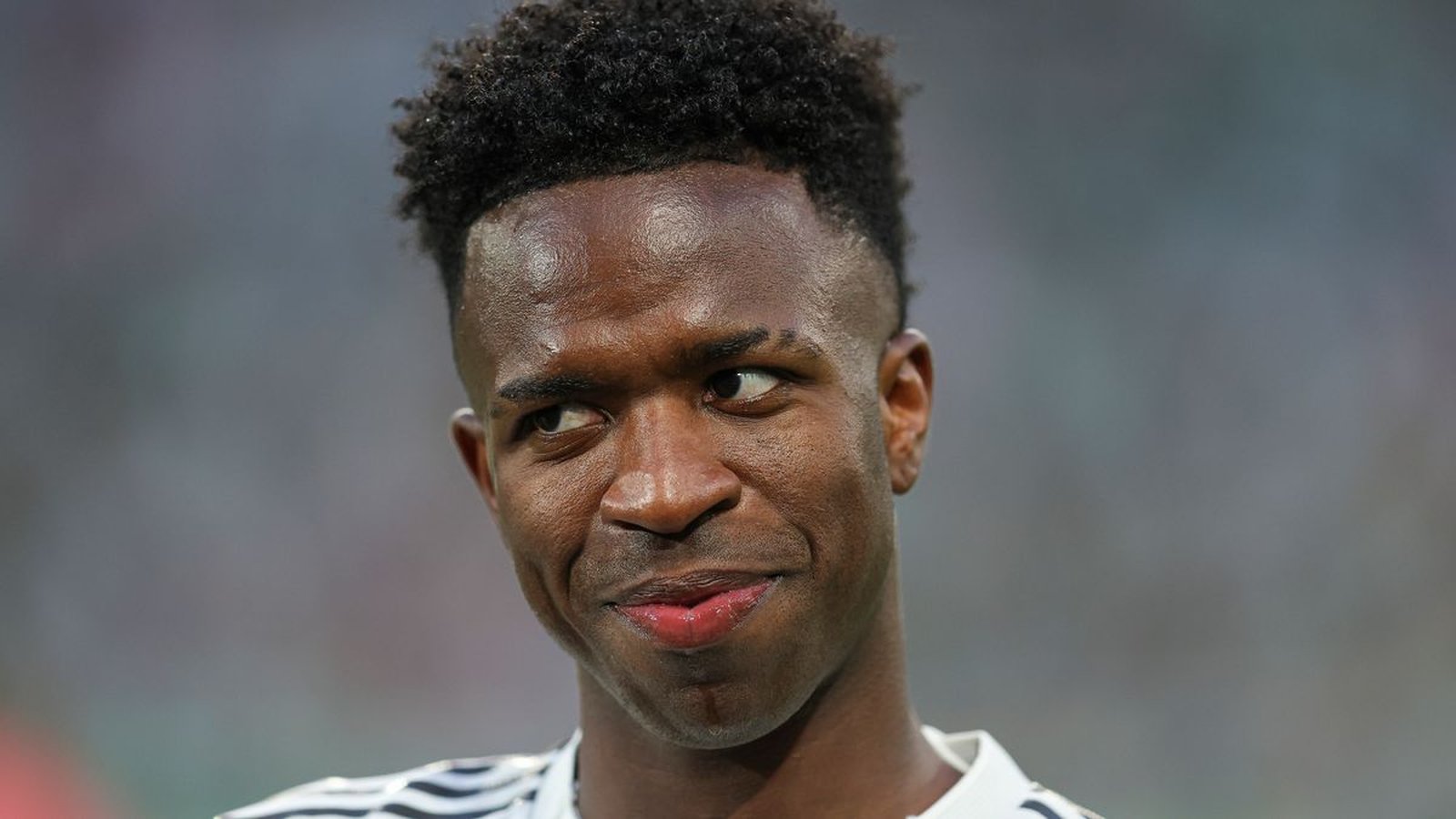 Close up portrait of Real Madrid footballer Vinicius Jr looking to the side