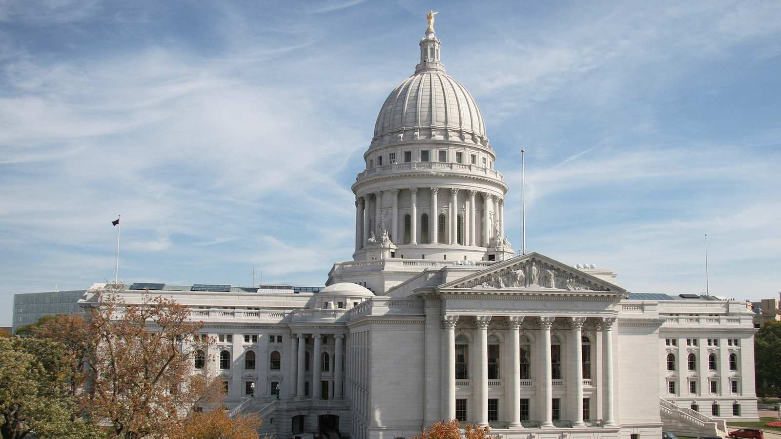 The Wisconsin State Capitol building exterior with its iconic dome under a blue sky