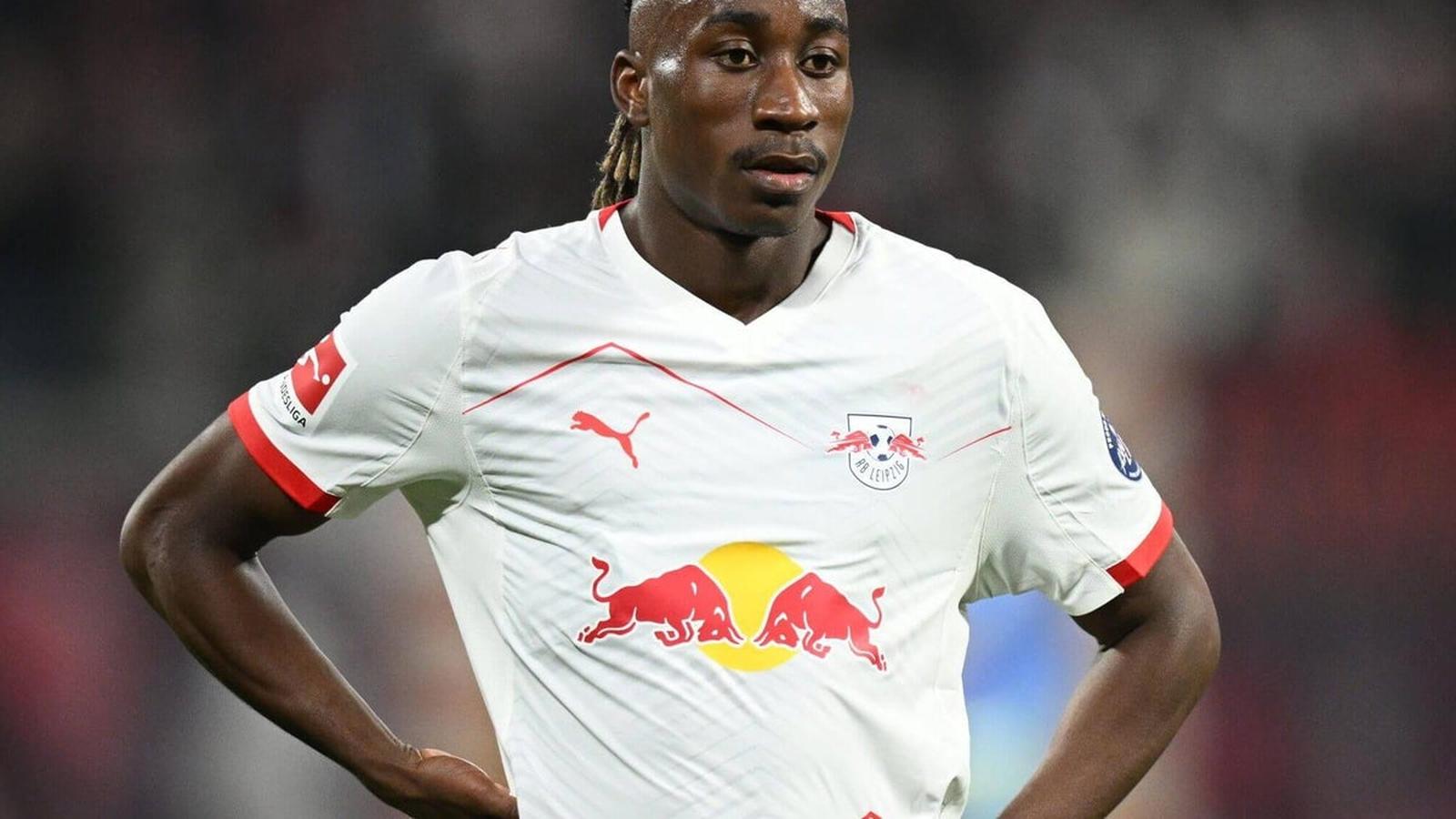 Yan Diomandé wearing the white RB Leipzig football kit during a match