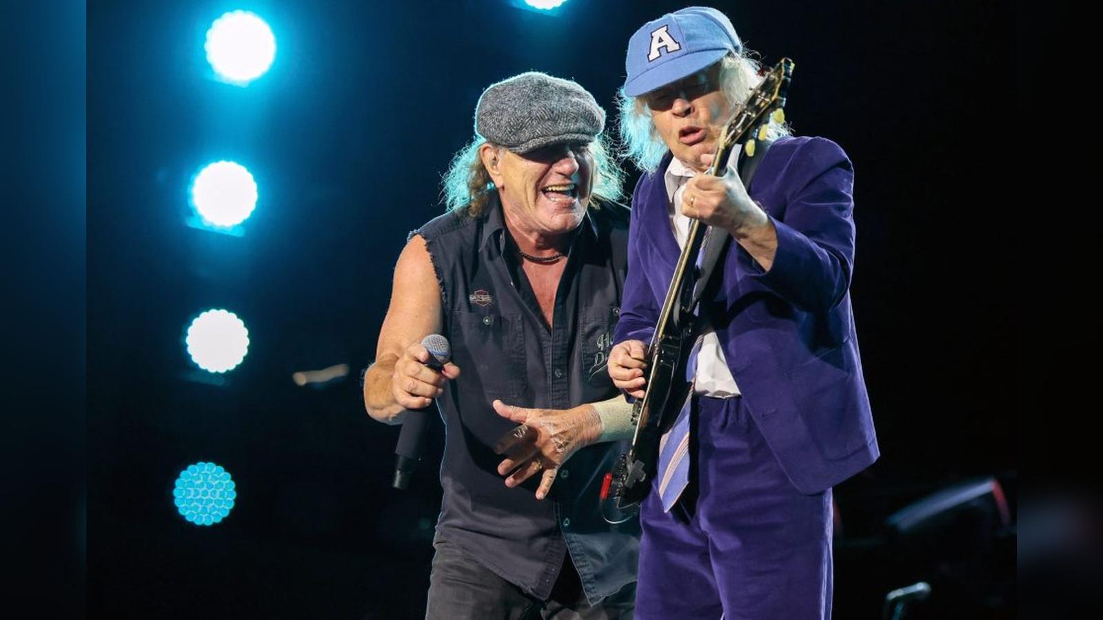 Brian Johnson and Angus Young of ACDC performing live on a concert stage
