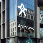 Modern glass office building exterior featuring the Anthropic company logo and branding