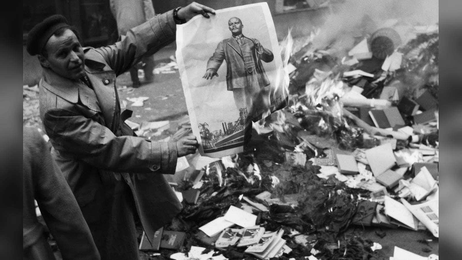 Protesters setting fire to a Lenin portrait on a Budapest street during the 1956 Hungarian Revolutio