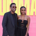 Chris Rock standing next to his daughter Zahra on a pink carpet event