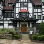 Exterior facade of a historic timber framed fraternity house building at Cornell University