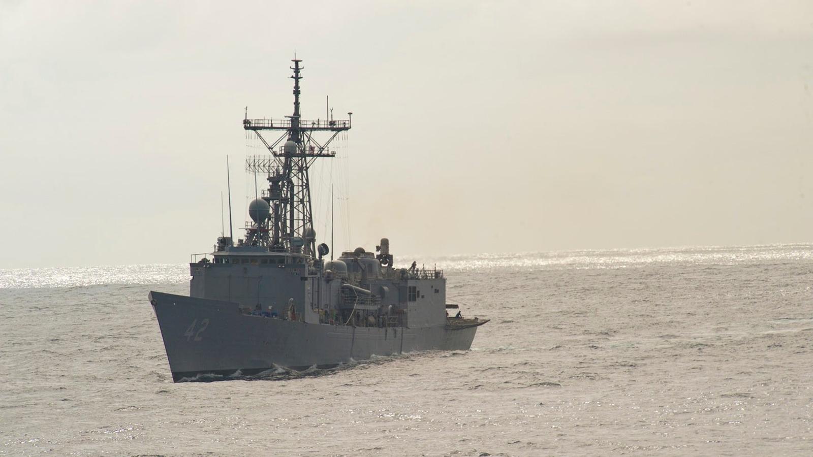 Decommissioned US Navy frigate ex-USS Klakring navigating the open sea during military exercises