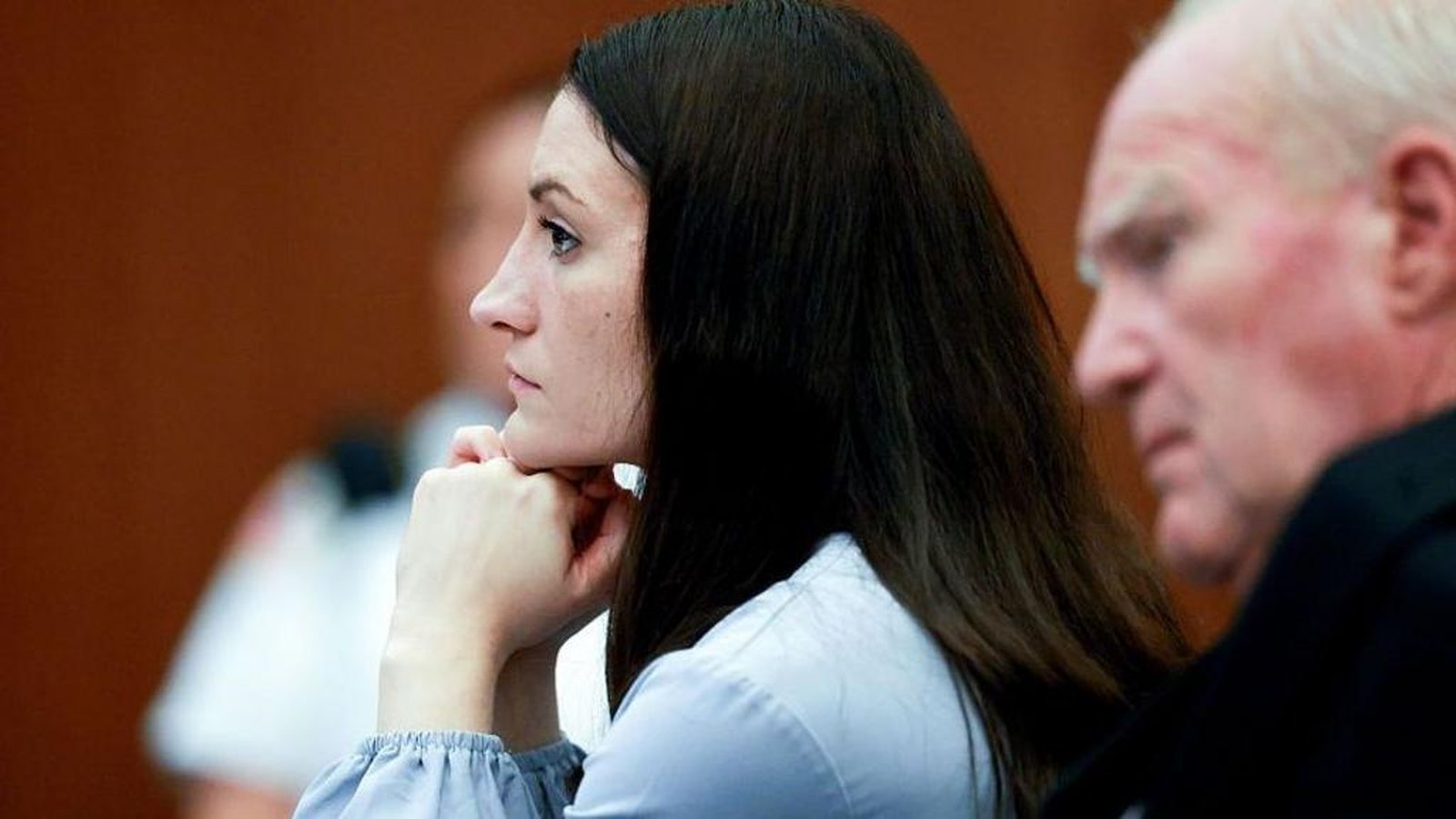 Lindsay Clancy sitting in court with her defense team during a status hearing
