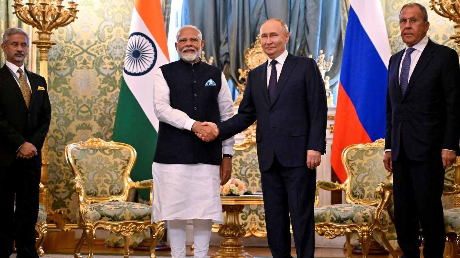 Indian Prime Minister Narendra Modi and Russian President Vladimir Putin shaking hands during a meet