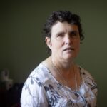 Portrait of an adult woman participant in a domestic setting representing NDIS policy updates