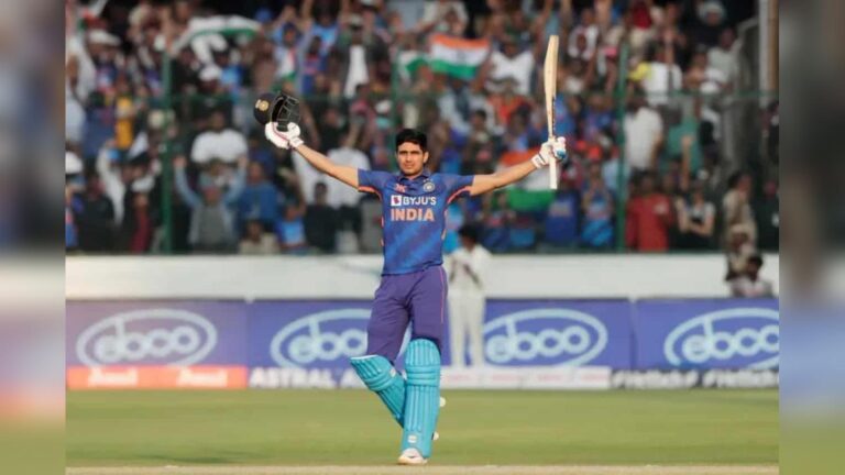 Indian cricketer Shubman Gill celebrating with bat raised after scoring a double century during an O