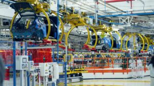 Vehicles on an industrial assembly line in a car manufacturing plant