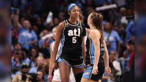 Angel Reese wearing an Atlanta Dream jersey on the basketball court during a game