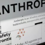Close-up view of a laptop screen displaying the Anthropic company website and logo