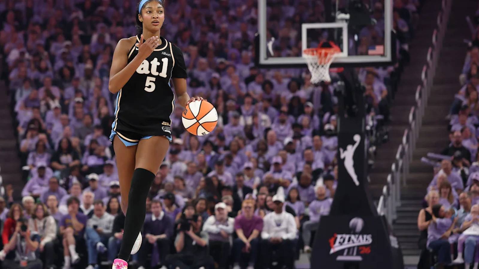 Angel Reese playing for Atlanta Dream contextual photograph, not an arrival outfit.