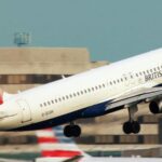 A British Airways passenger aircraft taking off from an airport runway