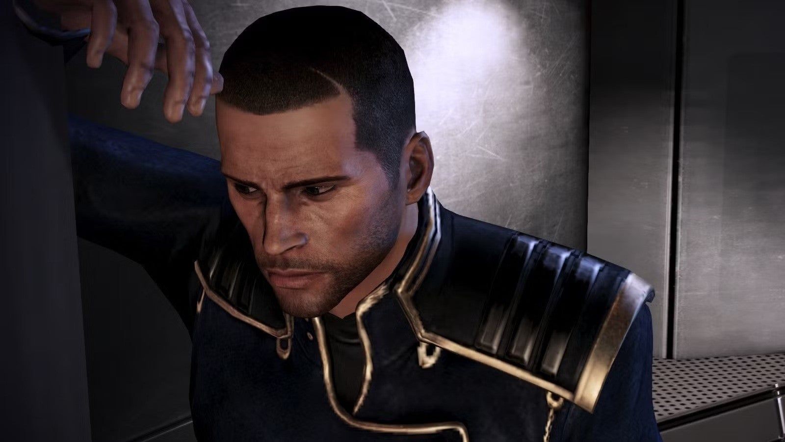 Close-up of Commander Shepard leaning against a wall in a dark futuristic interior