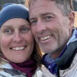 Portrait of British couple Craig and Lindsay Foreman outdoors near water