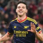 Declan Rice celebrating in an Arsenal kit during the Champions League match against Bayern Munich