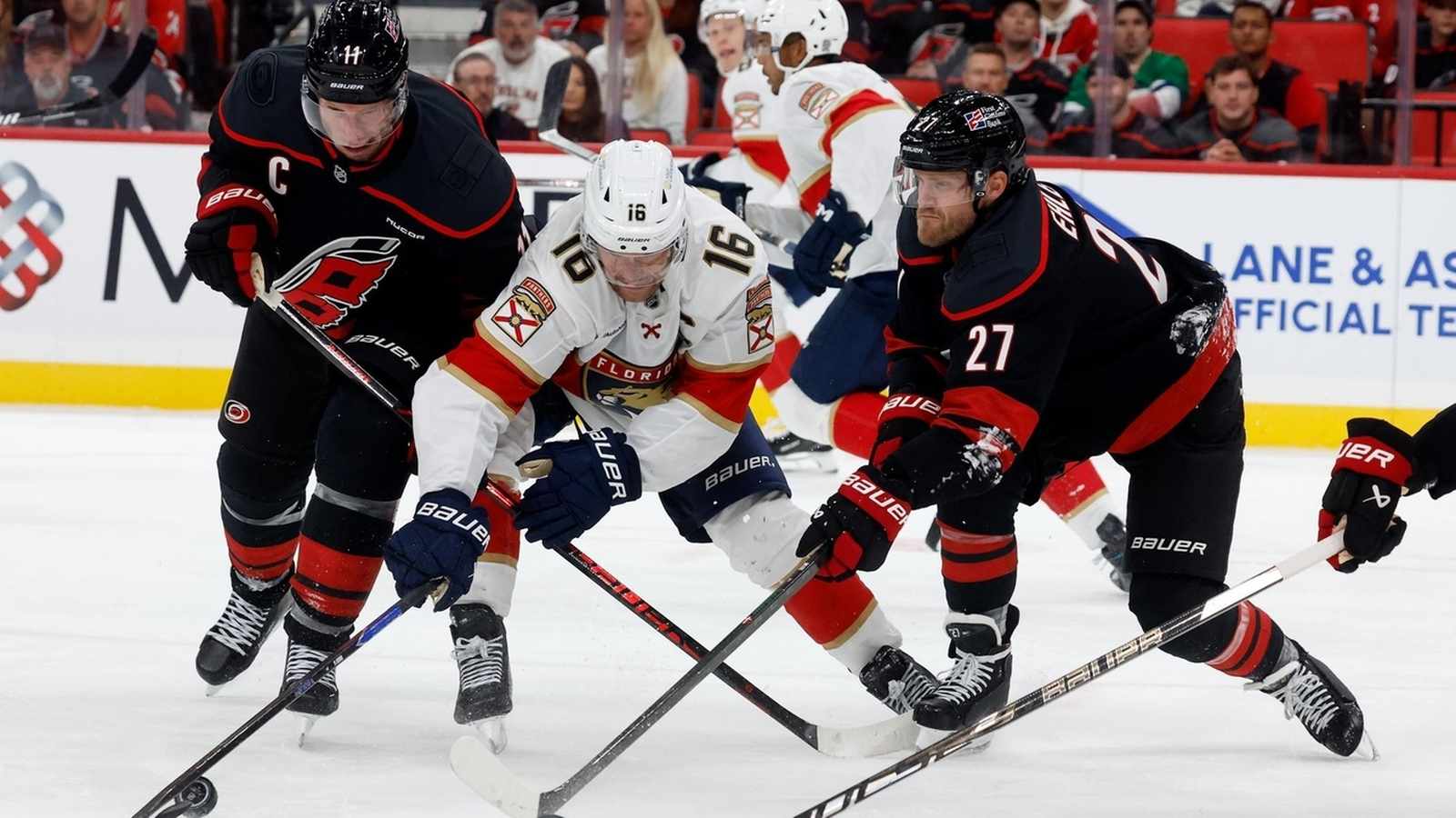 Florida Panthers players competing in a tense hockey match on the ice