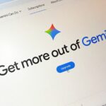 Laptop screen displaying the Google Gemini AI interface with an upgrade button