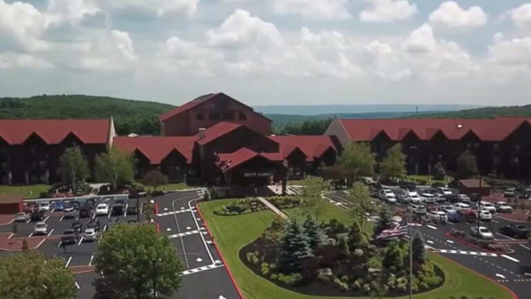 Aerial view of the Great Wolf Lodge resort with large parking lots and red roofs in the Poconos