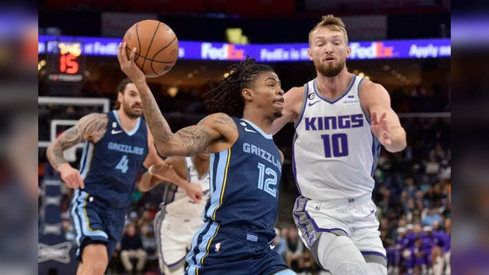 Memphis Grizzlies players competing against Sacramento Kings players on the basketball court during