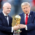 FIFA President Gianni Infantino and Donald Trump standing together holding the FIFA World Cup trophy