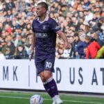 Jamie Donley wearing a number 10 Luton Town kit during a match