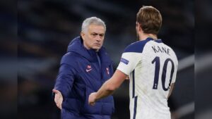 Manager Jose Mourinho talking to Tottenham player Harry Kane wearing number 10 jersey