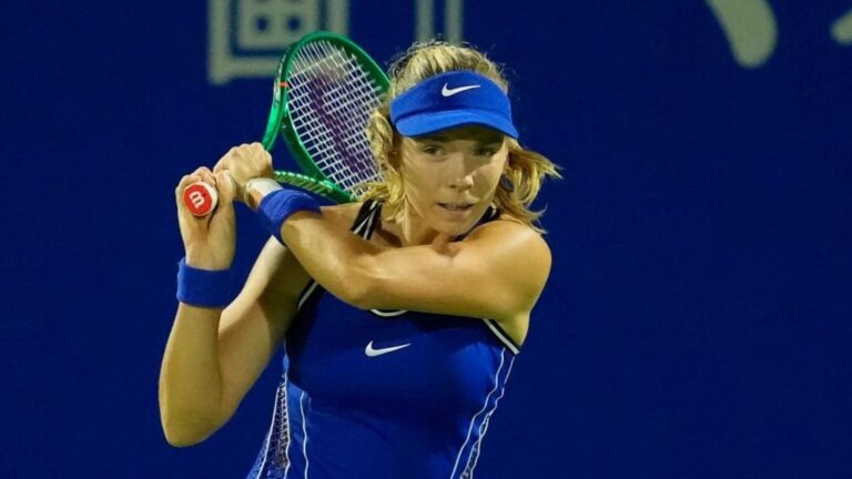 Katie Boulter playing tennis in a blue outfit holding a racket at the Japan Open