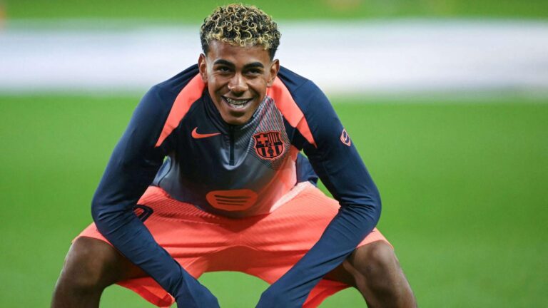 Lamine Yamal smiling during a Barcelona training session wearing team kit